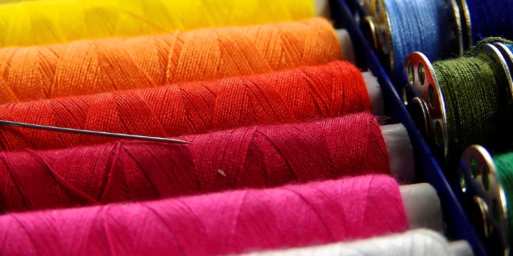 Colorful threads waiting to be used for sewing.